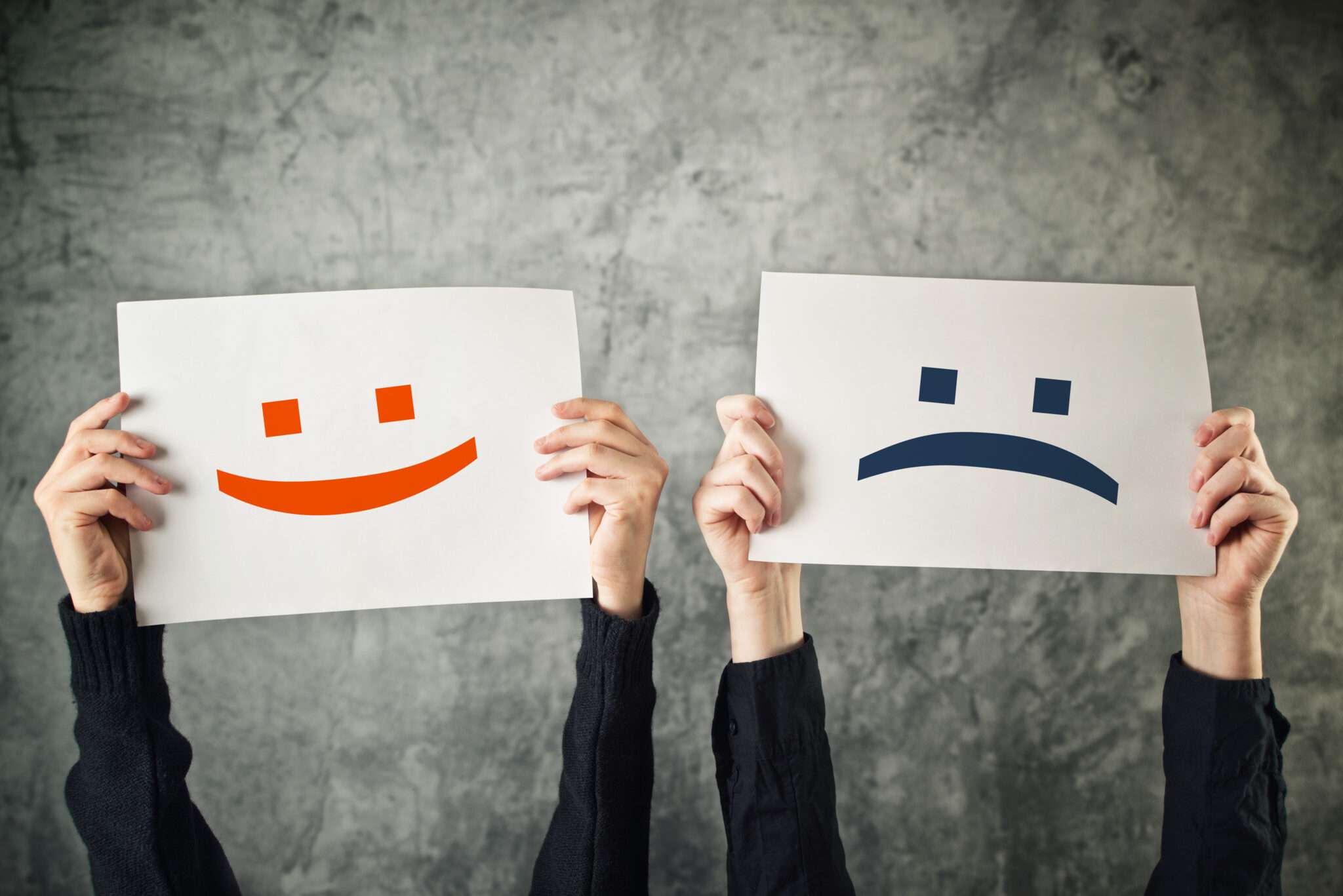 Happy,And,Sad,Face,Emoticons,,Two,Women,Holding,Papers,With