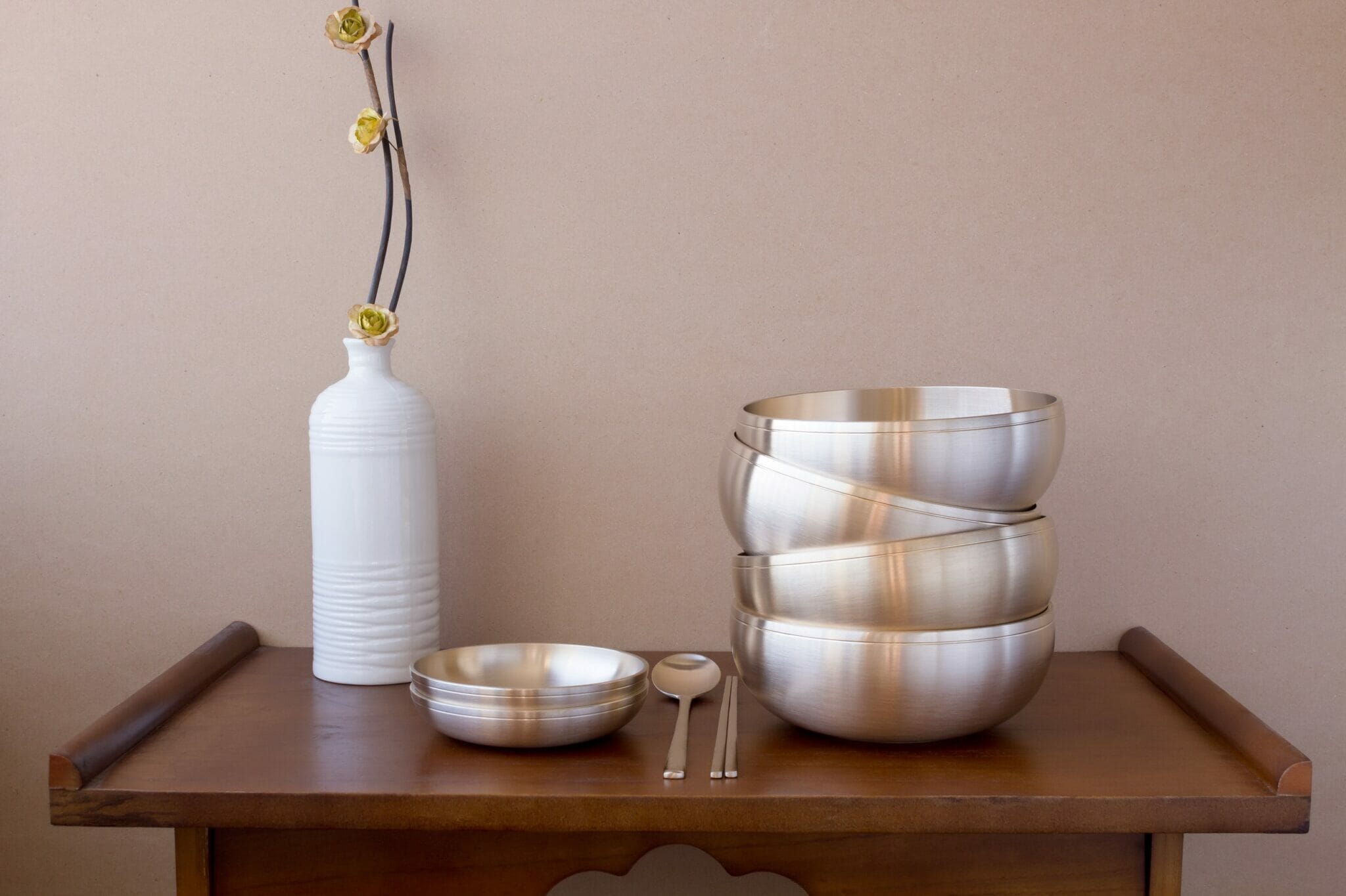 Korean,High,Quality,Brass,Tableware,On,The,Wooden,Table. Korean,High,Quality,Brass,Tableware,On,The,Wooden,Table.