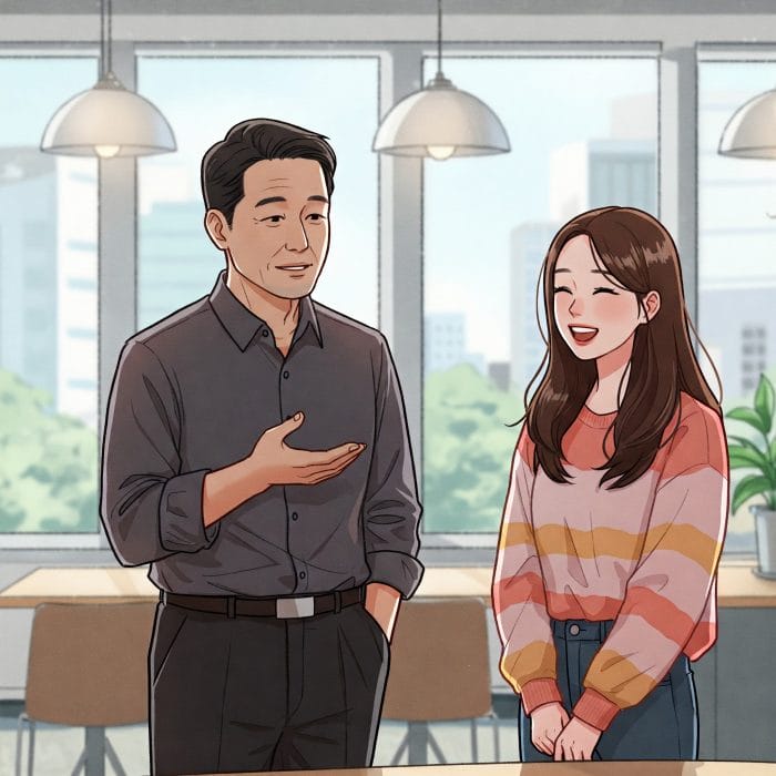 オフィスで話す年上の先輩と年下の後輩